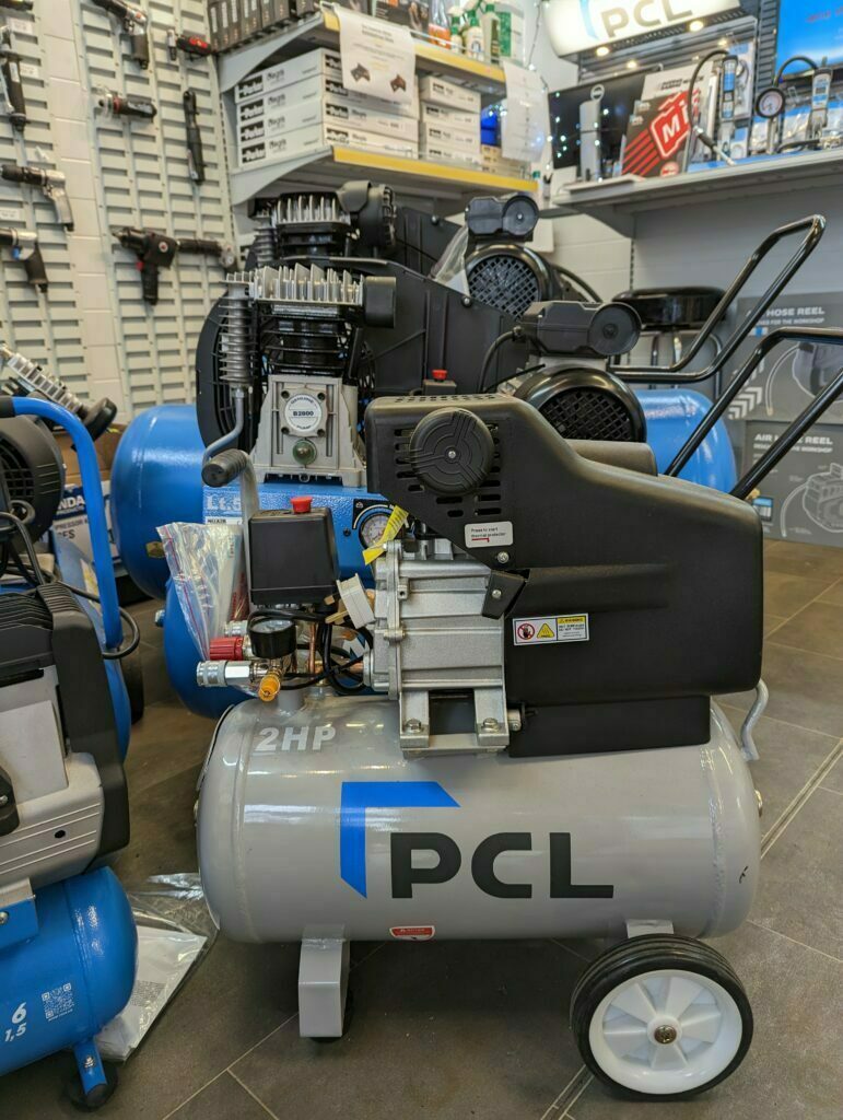 3 air compressors lined up for air compressor installation