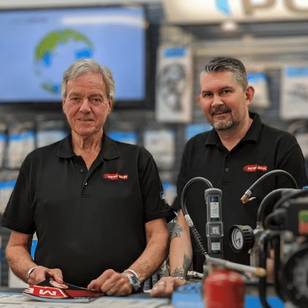 Metro sales owner Gary stands with Neil behind the counter of our Surrey based air compressor shop