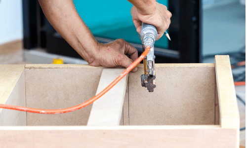 An air sander being used for woodworking