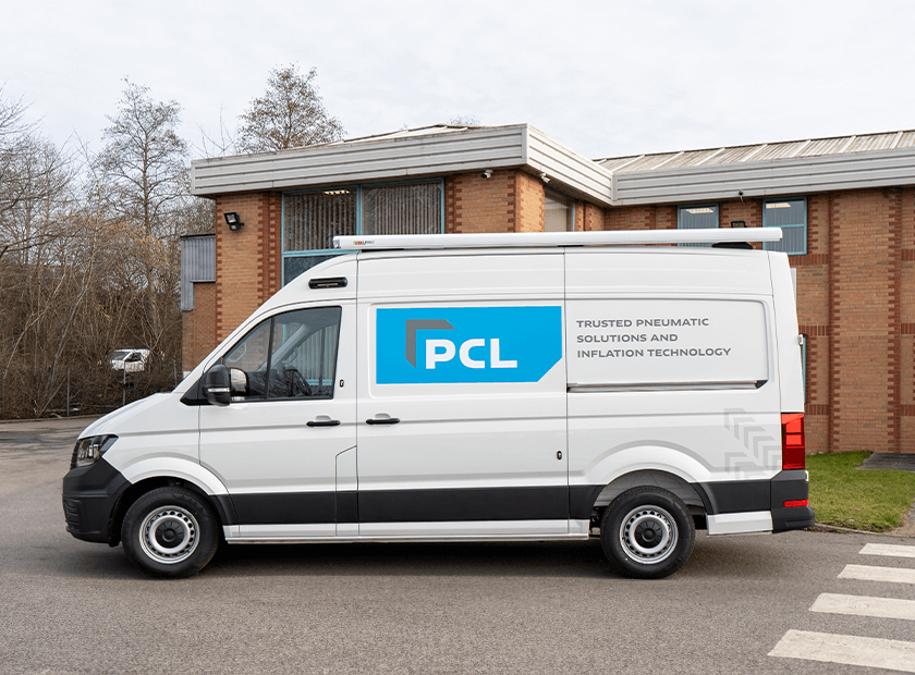 A view of the PCL compressor demo van from the outside showing PCL's logo on the side