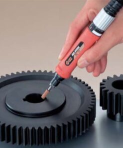 The Nitto Kohki Die Grinder being used on some cogs.