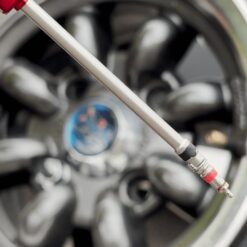 A close up of the long silver pointy end of a tyre valve core removal tool.