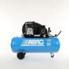 Product shot of the light blue Abac A39B 200 CM3 Belt driven compressor with 2 bigger black wheels at the back and a smaller wheel at the front for easy portability.