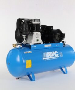 Product shot with a plain light grey background of the light blue Abac B6000 Compressor with black belt drive. The compressor has a static base.